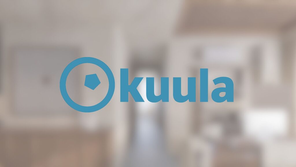  A blurred indoor scene with a blue circular logo containing a pentagon and the text "Kuula" centered on the image.